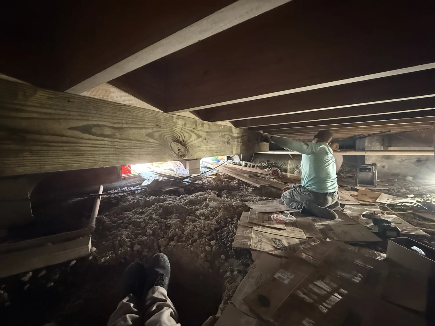 Work underway beneath a residential floor system.